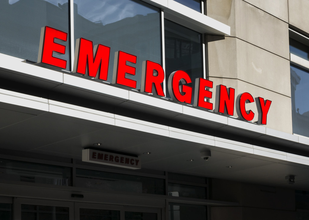 A closeup shot of the emergency room sign